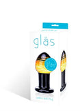 Glass butt plug, black with yellow-gold swirl, flared base and tapered tip