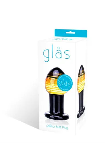 Glass butt plug, black with yellow-gold swirl, flared base and tapered tip