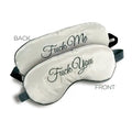 Cream satin sleep mask with “Fuck Me” and “Fuck You” embroidery, black elastic straps