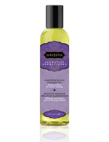 Massage oil bottle with black cap, yellow liquid, Harmony blend label