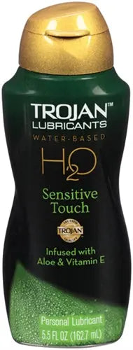 Water-based personal lubricant bottle with gold cap and Sensitive Touch label