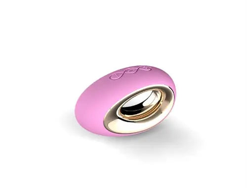 Pink circular handheld device with gold-toned metal inner ring