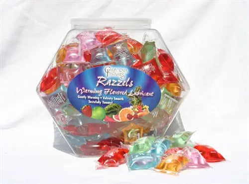 Assorted warming lubricant pieces in a clear plastic jar with wrapped pieces