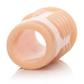Silicone enhancer sleeve with ridged surface, translucent peach tone