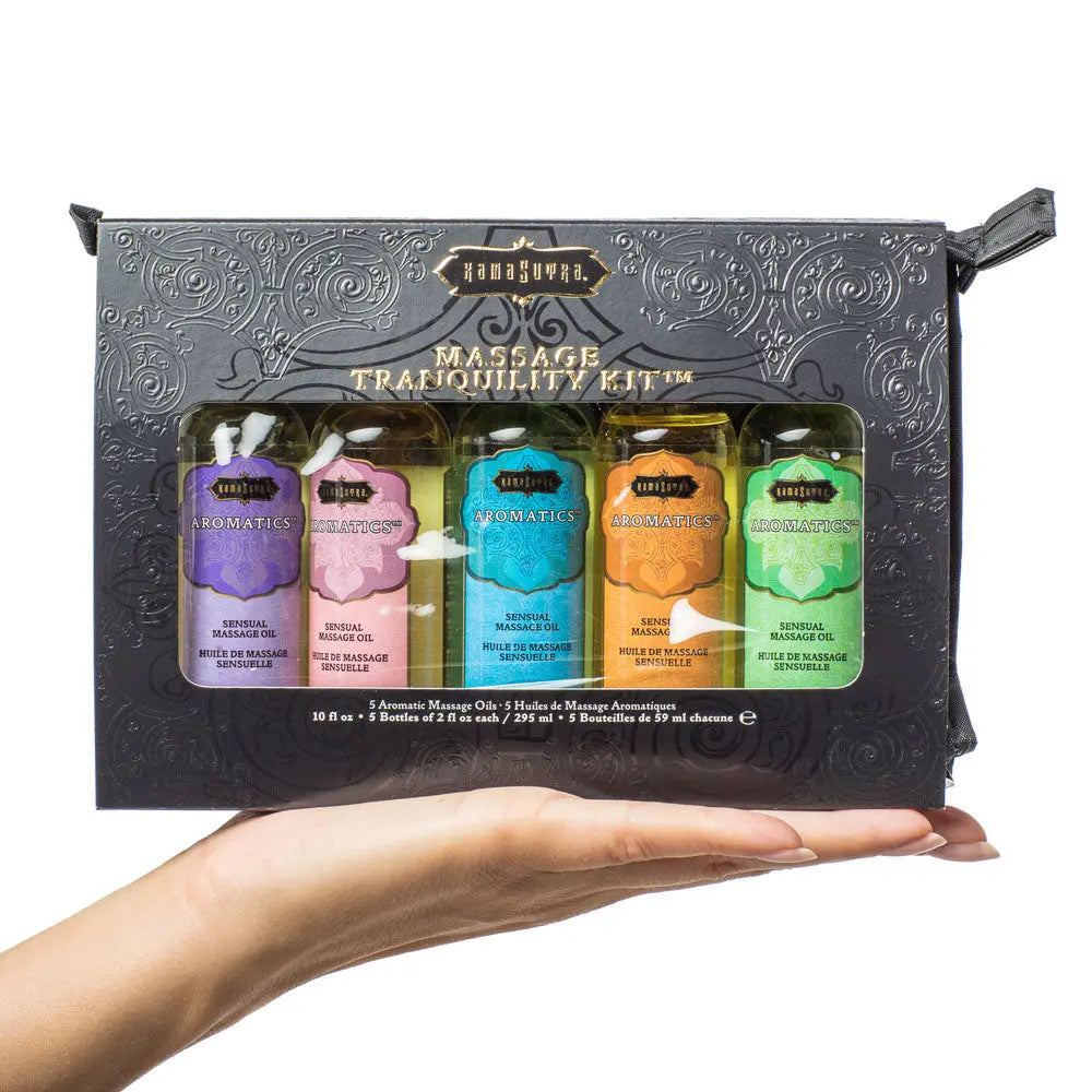 Massage tranquility kit pouch with five aromatherapy bottles in colored labels