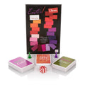 Entice card game set with box, three card decks, and red dice on display