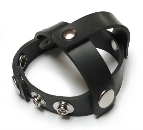 Black rubber cock harness with snap-on metal rings and buckle hardware
