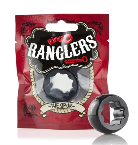 Novelty ring toy with black round spur design and red detailing, packaged