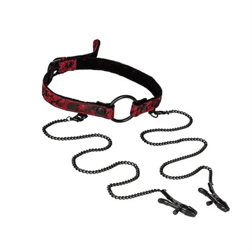Open-mouth gag with clamps, black and red patterned strap, metal ring and chain