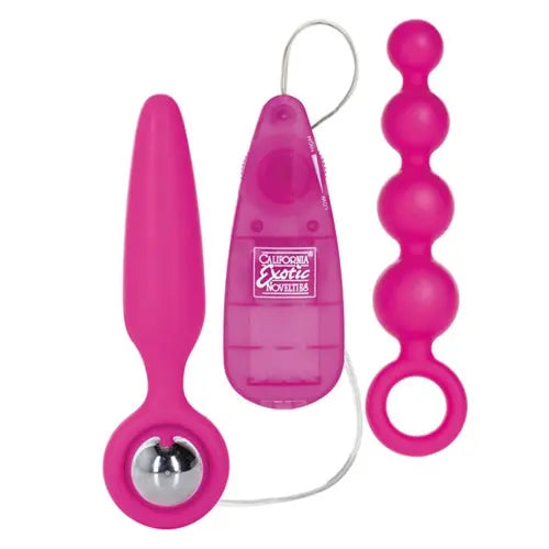 Pink silicone vibro kit with remote controls and three-bead butt plug