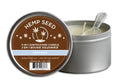 Massage candle tin with hemp seed label, open to reveal cream wax and wick