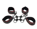Black and red hog-tie leg restraints with chain links and metal rings