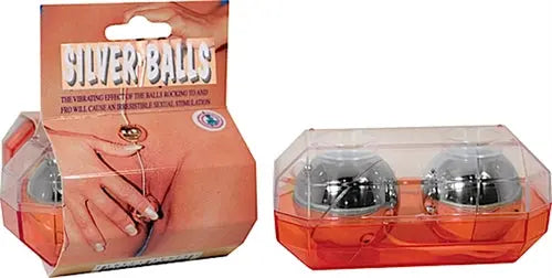 Silver ball set in clear plastic tray with two metallic spherical balls