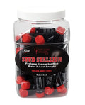 Male enhancement pills in clear tub with white lid; red and black tablets