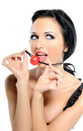 Red ball gag with black straps