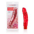 Red sex toy with curved shape and ribbed texture, with base ring