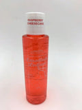 Raspberry cheesecake lotion bottle with red liquid, white cap and label