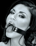 Black leather O-ring gag with metal rings and strap across mouth