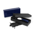 Blue pen set in open gray box with white tip, pouch, and papers