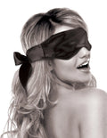 Satin blindfold with dark fabric and satin bow tie