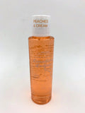Peaches & Cream lotion bottle with white cap and orange translucent bottle