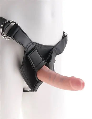 Black strap-on harness with ring and padded front panel, cock attachment