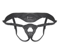 Black patent leather strap-on harness with wide waistband, leg straps, and front ring