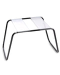 Metal sex stool with clear rectangular top and curved black frame