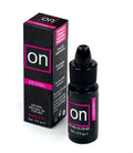 Natural arousal oil bottle with small box, black and magenta, 5 ml.