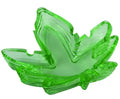Green leaf-shaped glass ashtray with raised veins and curved bowl