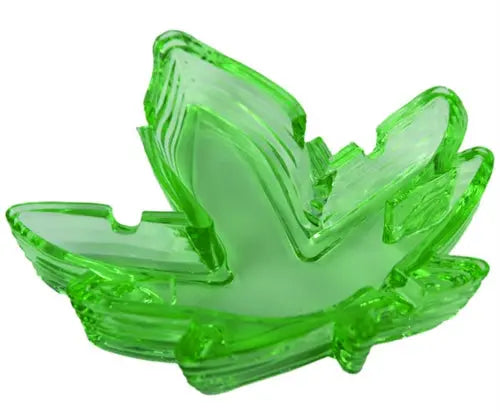 Green leaf-shaped glass ashtray with raised veins and curved bowl