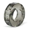 Smoke-clear sprocket cock ring with atomic jock symbols, translucent gray