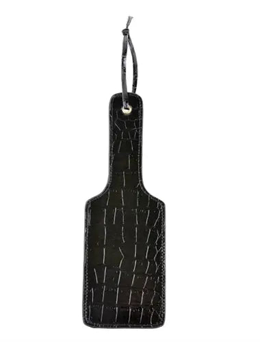 Black faux-leather paddle with hanging loop and gold-tone accent