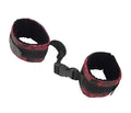 Fabric cuffs with black base and red patterned lining, adjustable strap and buckle