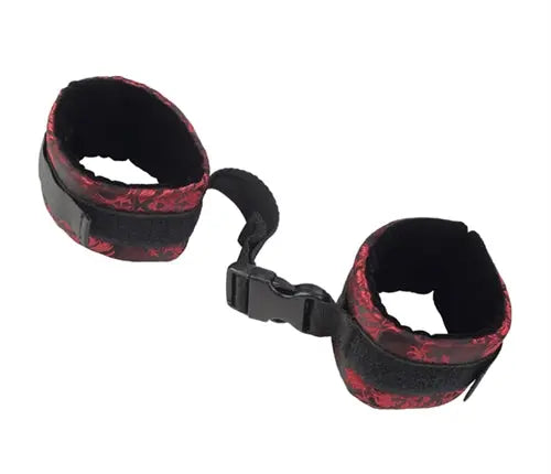 Fabric cuffs with black base and red patterned lining, adjustable strap and buckle