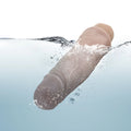 Beige waterproof silicone adult massager with tapered head, submerged in water