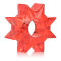Red star-shaped plastic piece with central circular cutout