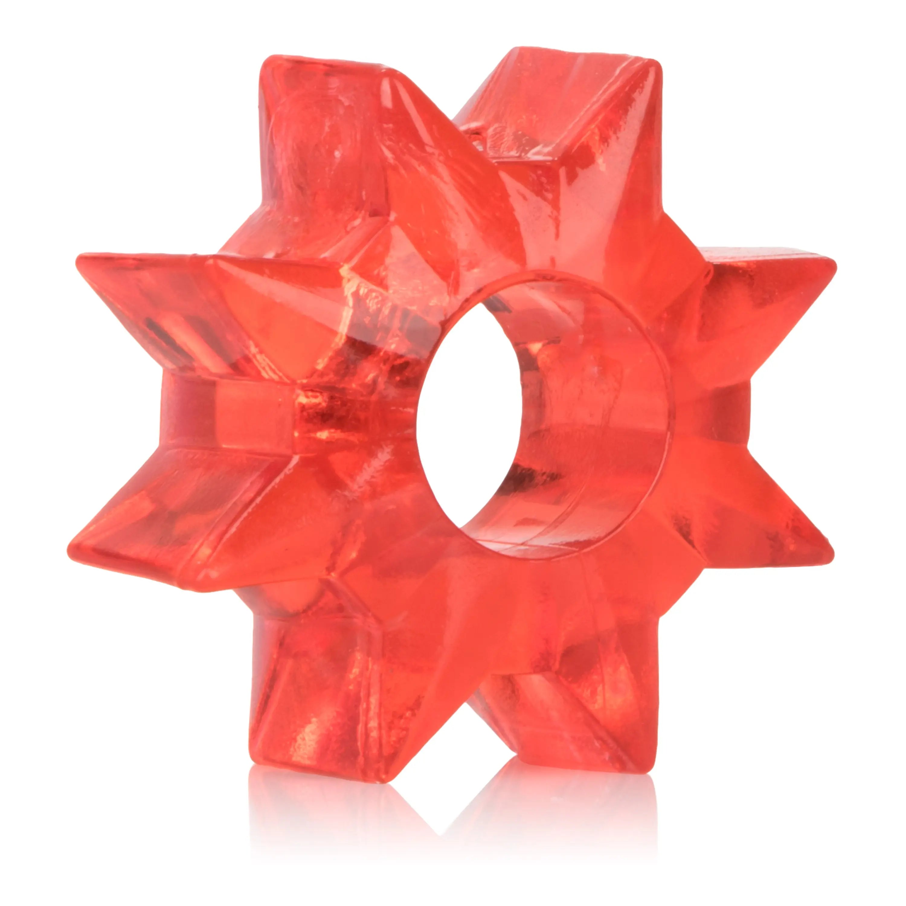 Red star-shaped plastic piece with central circular cutout