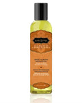 Aromatic massage oil bottle with sweet almond scent, black cap and amber label