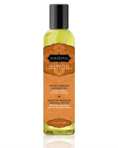 Aromatic massage oil bottle with sweet almond scent, black cap and amber label