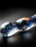 Icicle-shaped clear and blue glass ornament with rainbow swirl