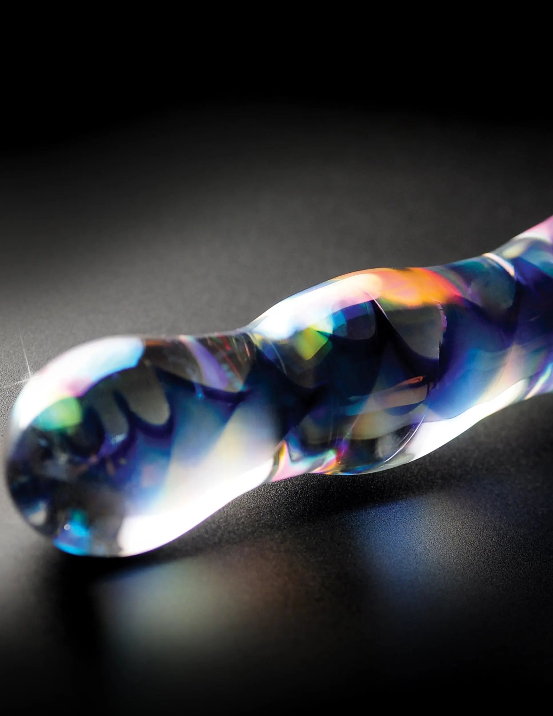 Icicle-shaped clear and blue glass ornament with rainbow swirl