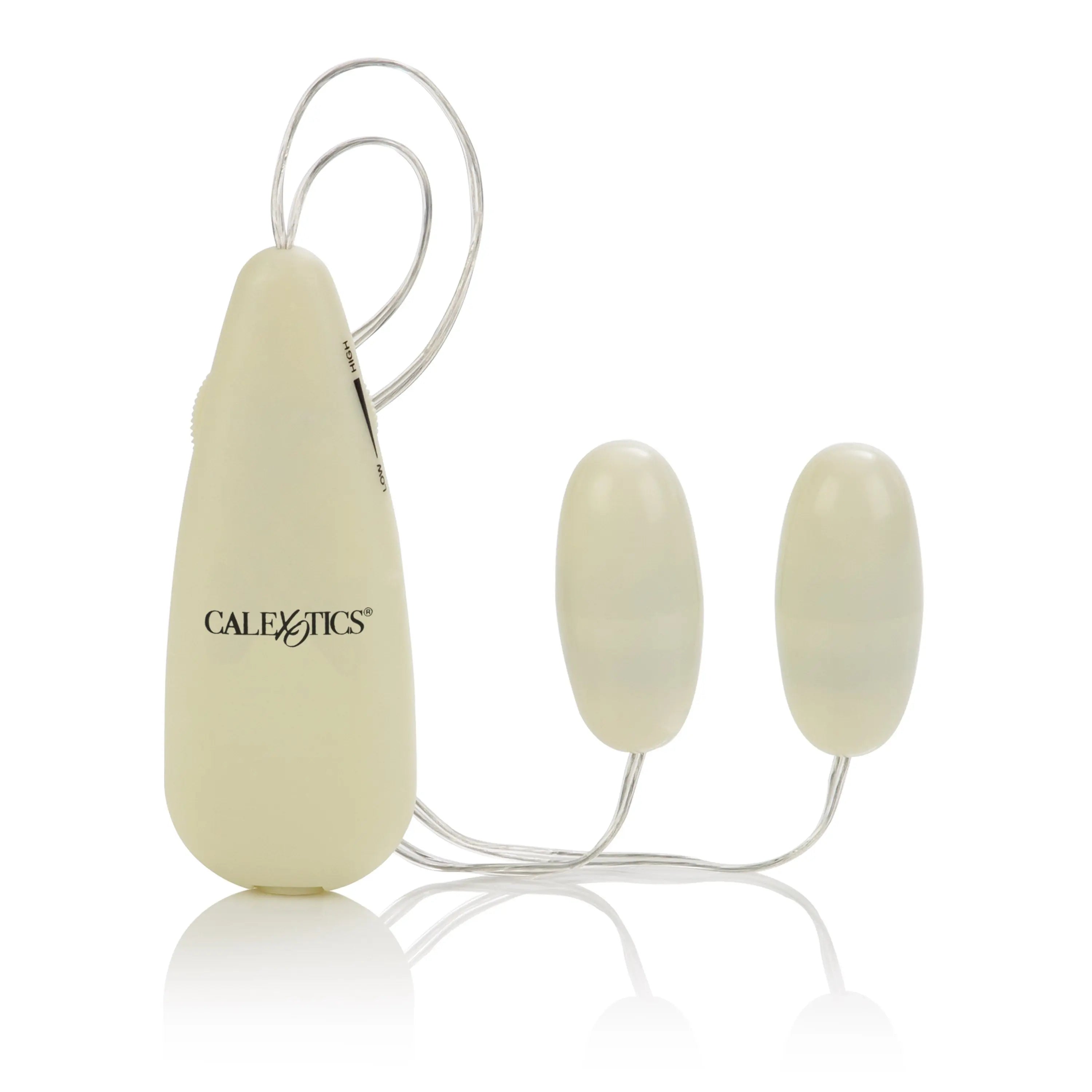 CALExotics glow-in-the-dark double bullet vibrator with two oval pale-yellow tips and cords