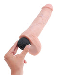 Light pink realistic penis toy with balls and ribbed base