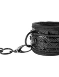 Black couture cuff with chain and studded metal trim