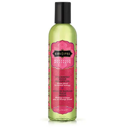Massage oil bottle with green liquid and strawberry pink label, black cap.
