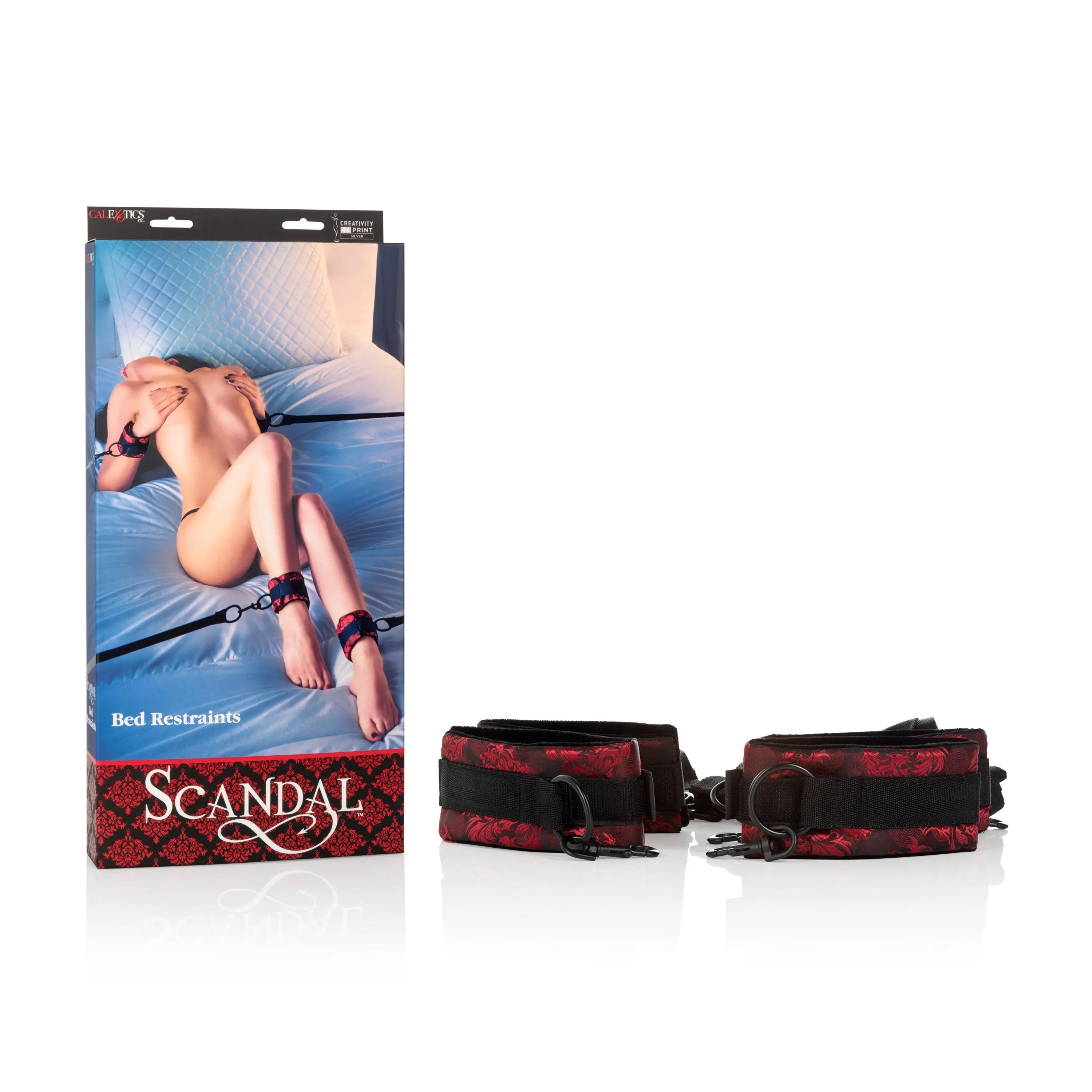 Bed restraints set with red and black straps, padded cuffs, and metal buckles
