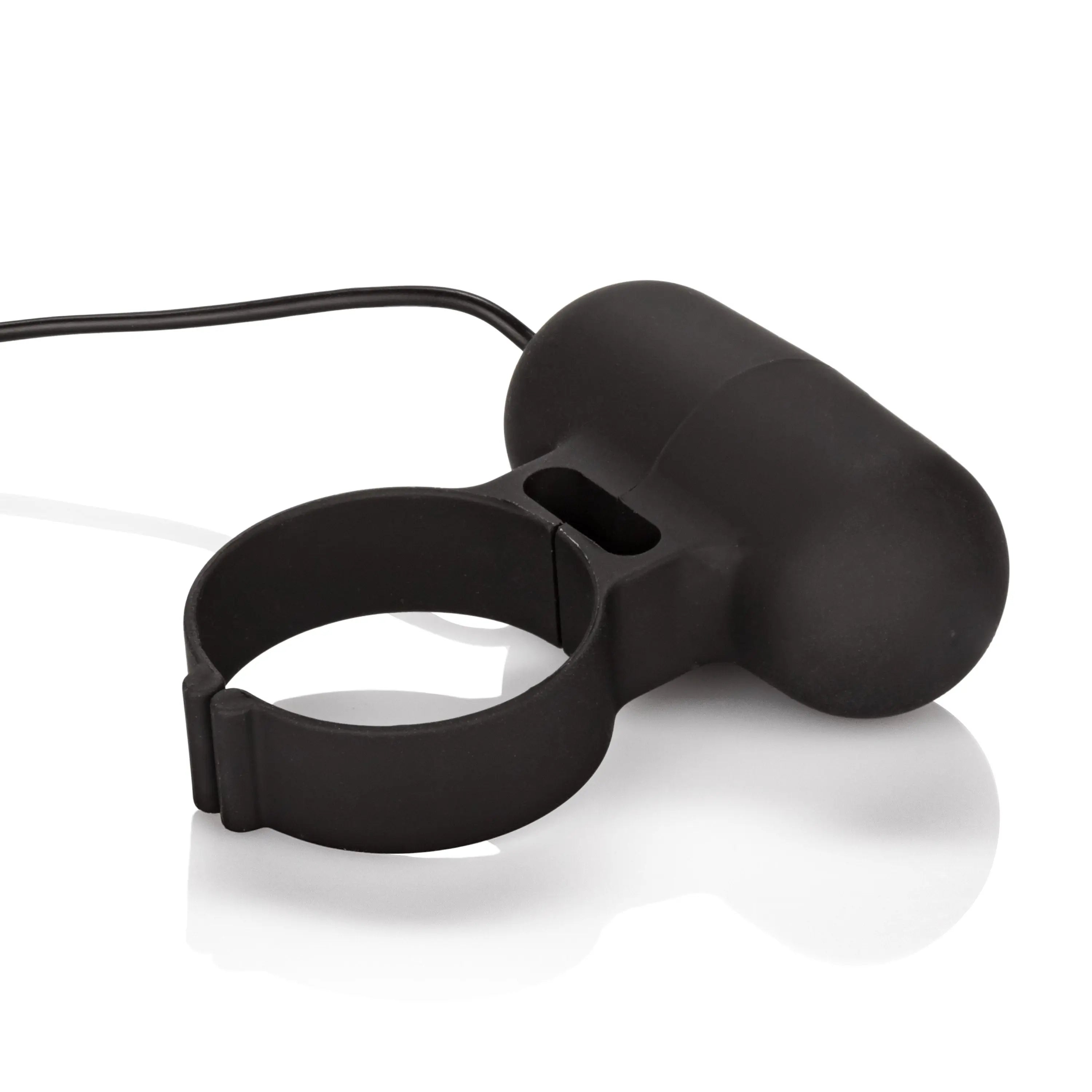 Black cockring with attached oval pad and connecting cable